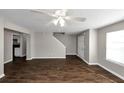 Open living room with hardwood floors and access to the kitchen at 4229 Reeshemah St, Union City, GA 30349