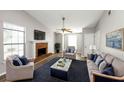 Living room with fireplace, hardwood floors, and comfy seating at 5277 Brentwood Rd, Atlanta, GA 30349