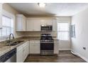 Renovated kitchen with stainless steel appliances and granite countertops at 667 Steve Sw Dr, Atlanta, GA 30315