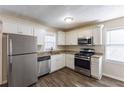 Renovated kitchen with stainless steel appliances and granite countertops at 667 Steve Sw Dr, Atlanta, GA 30315