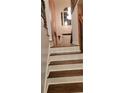 Elegant wooden staircase with wrought-iron railing leading to the second floor at 1886 Clay Sw Dr, Marietta, GA 30064