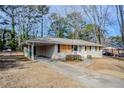 Front view of brick ranch house needing some repairs at 1967 Glen Echo Dr, Decatur, GA 30032