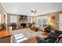 Bright living room featuring hardwood floors and a stone fireplace at 156 Main St, Lilburn, GA 30047