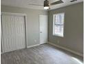 Spacious bedroom with double doors and ceiling fan at 175 Brown Rd, Stockbridge, GA 30281