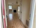 View of spacious living room with fireplace and wood floors at 2800 Camelot Woods Dr, Lawrenceville, GA 30044