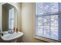 Small bathroom with pedestal sink and window blinds at 1653 Perserverence Hill Nw Cir # 10, Kennesaw, GA 30152