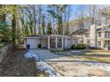 Front view of a renovated ranch home with driveway at 1883 La Mesa Ln, Decatur, GA 30032