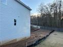 Side yard of a two-story house showing unfinished landscaping at 566 Abbott Se Ct, Atlanta, GA 30354