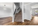 Clean staircase featuring carpeted steps, neutral walls, and access to the main level at 125 Cinnamon Fern Cir, Covington, GA 30016