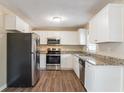 Updated kitchen with stainless steel appliances and granite countertops at 3018 Meadowview Se Dr, Atlanta, GA 30316