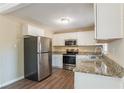 Updated kitchen with stainless steel appliances and granite countertops at 3018 Meadowview Se Dr, Atlanta, GA 30316