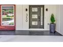 Modern front door with glass panels and sleek hardware at 350 Jayne Ellen Way, Alpharetta, GA 30009