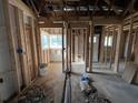 Under construction home's interior framing with exposed beams and wiring at 1739 Carter Cir, Atlanta, GA 30344