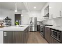 Modern kitchen with stainless steel appliances and an island at 775 Juniper Ne St # 413, Atlanta, GA 30308