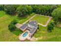Aerial view of the house, pool, and expansive backyard at 833 Hines Rd, Moreland, GA 30259