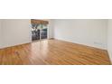 Bright bedroom with hardwood floors, large sliding glass doors, and a view of the outdoors at 1634 Ponce De Leon Ne Ave # 514, Atlanta, GA 30307