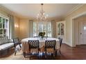 Elegant dining room with a chandelier and hardwood floors at 106 Peachtree Battle Nw Ave, Atlanta, GA 30305