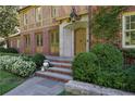 Brick front entrance with stone steps and landscaping at 106 Peachtree Battle Nw Ave, Atlanta, GA 30305