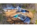 Elevated view of home, pool, and detached garage at 3246 E 5 E Hwy, Carrollton, GA 30116