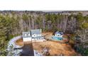 House with pool and detached building on wooded lot at 3246 E 5 E Hwy, Carrollton, GA 30116