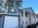 Ranch style home with attached garage and brick facade at 3464 Creatwood Se Trl, Smyrna, GA 30080