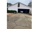 Spacious garage with parked cars, providing secure parking and storage space, plus a driveway at 850 Thurman Rd, Stockbridge, GA 30281