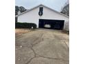 Spacious two car garage with large driveway and traditional exterior and holiday decorations at 850 Thurman Rd, Stockbridge, GA 30281