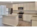 Modern kitchen with stainless steel appliances and granite countertops at 140 Tye St, Stockbridge, GA 30281