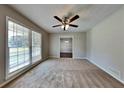 Bright living room featuring hardwood floors and a ceiling fan at 532 Greg Sw Dr, Lilburn, GA 30047