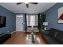 Bright and airy living room with a large window, comfortable seating, and a modern aesthetic at 2353 Maplewood Se Ct # 25, Atlanta, GA 30339