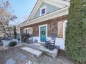 Inviting front porch with rocking chairs and teal door at 731 E Main St, Canton, GA 30114