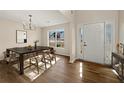 Spacious dining area with hardwood floors and a chandelier at 5055 Roxton Ln, Douglasville, GA 30135