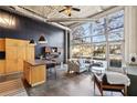 Open concept living area with kitchen and large windows at 5200 Peachtree Rd # 1111, Atlanta, GA 30341