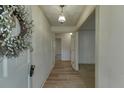 Bright entryway with light wood flooring and wreath at 5694 Cub Ct, Stone Mountain, GA 30087