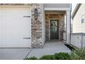 Dark gray front door with glass panels and a wreath at 150 Auburn Depot Dr, Auburn, GA 30011