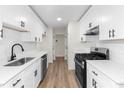 Modern kitchen featuring white shaker cabinets and stainless steel appliances at 2966 Knollberry Ln, Decatur, GA 30034