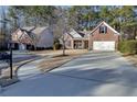 Curved driveway leading to a brick home in a quiet cul-de-sac neighborhood at 4334 Austin Farm Trl, Acworth, GA 30101