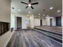 Spacious living area with new flooring, recessed lighting, and a ceiling fan at 188 Oak Dr, Atlanta, GA 30354