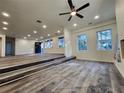 Open living area with wood-look vinyl flooring and multiple windows at 188 Oak Dr, Atlanta, GA 30354