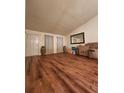 Spacious living room with wood-look floors and large windows at 2210 Burdett Ridge, Atlanta, GA 30349