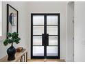 Modern entryway featuring glass double doors and minimalist decor at 2870 Daws Se Ave, Atlanta, GA 30317