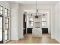 Modern kitchen boasts a large marble island and dark cabinetry at 94 Sheridan Dr, Atlanta, GA 30305