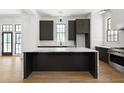 Sleek kitchen with marble island and dark cabinetry at 94 Sheridan Dr, Atlanta, GA 30305