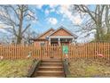 Charming craftsman home with a picket fence and manicured front yard at 1736 Thompson Ave, Atlanta, GA 30344