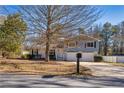 Two-story house with blue siding, white brick, and a two-car garage at 2778 Majestic Cir, Dacula, GA 30019