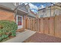 Welcoming entryway with a classic front door, a covered porch, and a wooden fence for added privacy at 218 Forkner Dr # D, Decatur, GA 30030