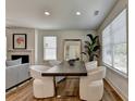 Modern dining room featuring a dark wood table and white chairs at 1591 Salem Dr # 76, Conyers, GA 30013