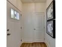 Bright entryway with wood-look floors and white walls at 1591 Salem Dr # 76, Conyers, GA 30013