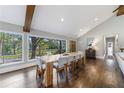 Spacious dining area with hardwood floors and wall-to-wall windows offering scenic views at 9585 Hutcheson Ferry Rd, Palmetto, GA 30268