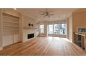 Spacious living room boasts a modern fireplace, built-in shelving, and bright natural light at 120 Ridgely Ct, Atlanta, GA 30342